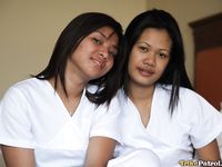 Filipino Caregivers Joanna and Joy Pose in Bed in Their White Uniforms 
Hot Filipino Nurses Joanna and Joy in White Uniforms on Bed