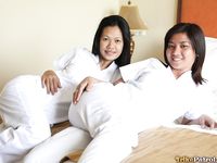 Filipino Caregivers Joanna and Joy Pose in Bed in Their White Uniforms 
Hot Filipino Nurses Joanna and Joy in White Uniforms on Bed