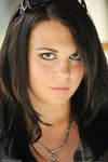 Sexy amateur Julie flaunts her beautiful breasts and poses naked solo.