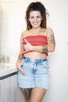 Big-boobed hippie Indica Flower strips down and shows off her gorgeous curves.