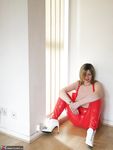 Posh Sophia Unleashes Her Huge Tits from Red Latex Dress