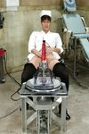Nurse Isis Love Gets Wet with a Sex Machine Toy