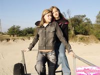 Young Lesbians Laura and Katrina Flash Their Tiny Tits on the Beach