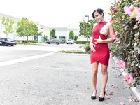 Dark-Haired Woman with a Killer Smile Lifts Her Dress to Reveal Her Ass.

Sultry Brunette Bares All with a Seductive Grin.