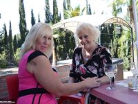 Blonde MILF Melody and Lesbian Babe Get Steamy on the Terrace