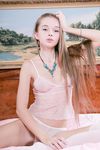 Tiny teen Milena D poses in pink stockings and spreads her pussy