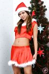 Amateur Model Teases with Medium Tits in Santa Hat, Showing Off Shaved Pussy