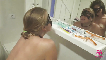 Naughty Lesbian Kitties Play with Strap-On Dildo in the Bathroom