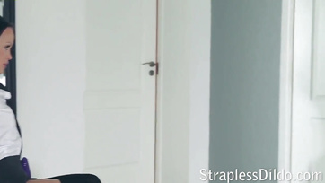 Sexy babe in stockings gets fucked with a strap-on dildo