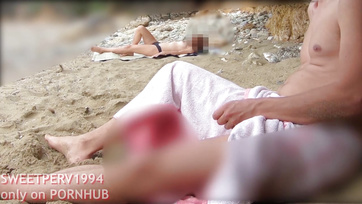 A petite girl jerks off a kinky guy at the beach