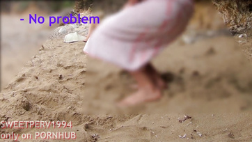 A petite girl jerks off a kinky guy at the beach
