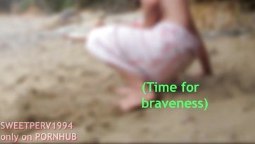 A petite girl jerks off a kinky guy at the beach