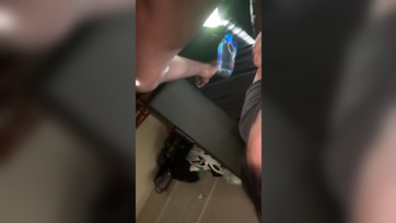 Tugging with both hands, she sucks on the huge black cock
