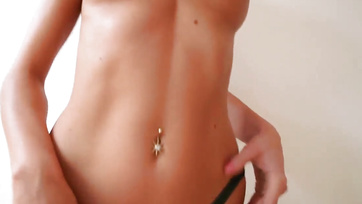 Busty Hungarian Porn Star Strips Down to Show Off Her Sexy Body